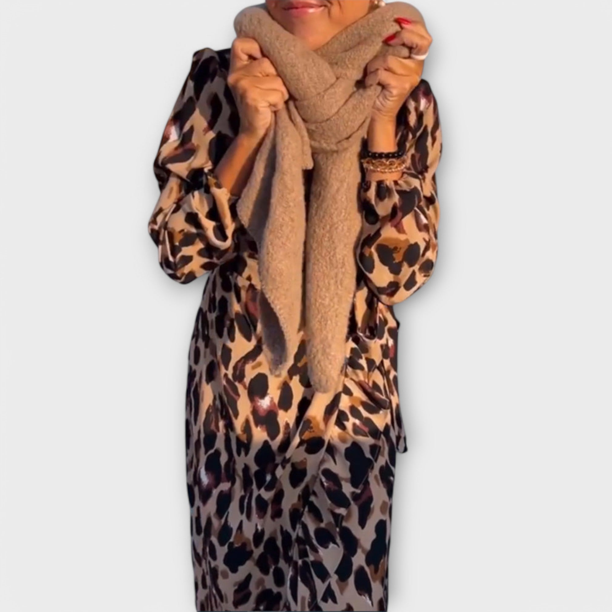 A loose leopard print dress with a V-neck